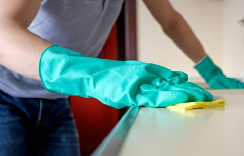 Curtain cleaning technician working in a Harrow property